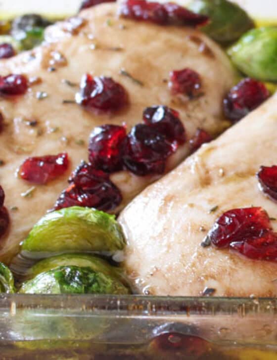 Cranberry balsamic chicken in baking dish straight out of the oven.