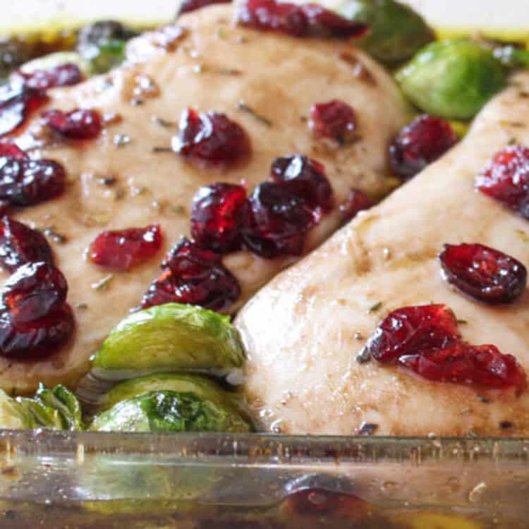 Cranberry balsamic chicken in baking dish straight out of the oven.