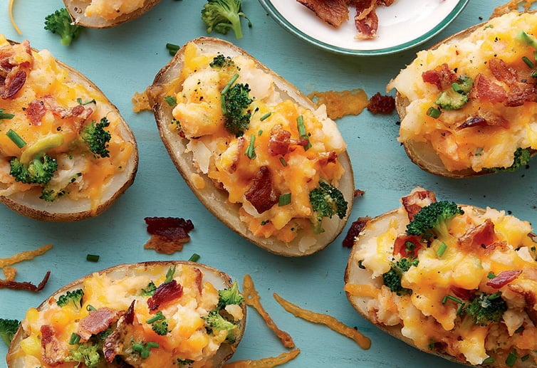 gluten-free twice stuffed baked potatoes on a cutting board