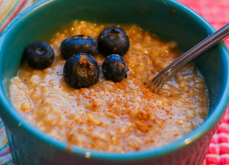 Close up image of instant pot steel cut oatmeal with blueberries