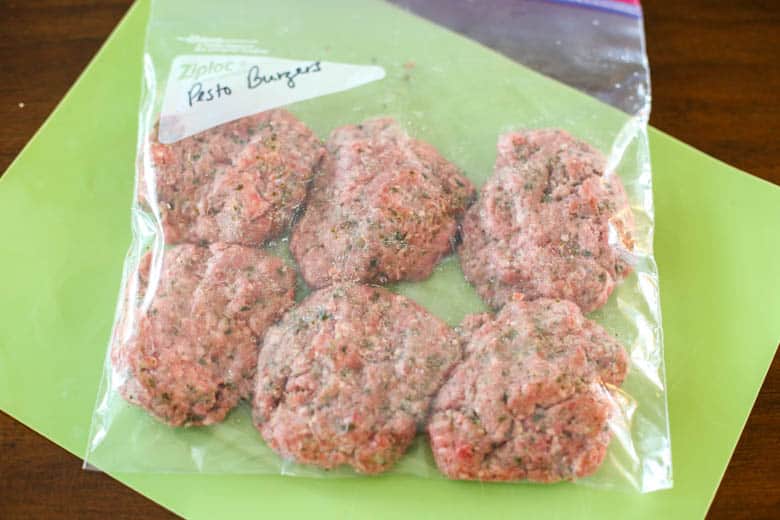 Pesto burgers in a freezer bag.