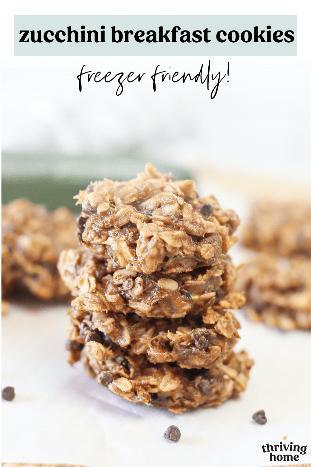 Zucchini breakfast cookies stacked up on a counter.