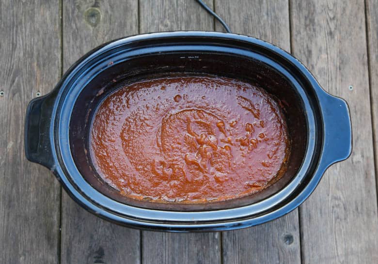 Fully cooked apple butter in a slow cooker. 