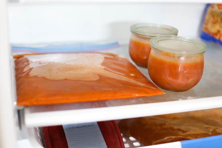 Frozen tomato soup in bag and in jars in the freezer