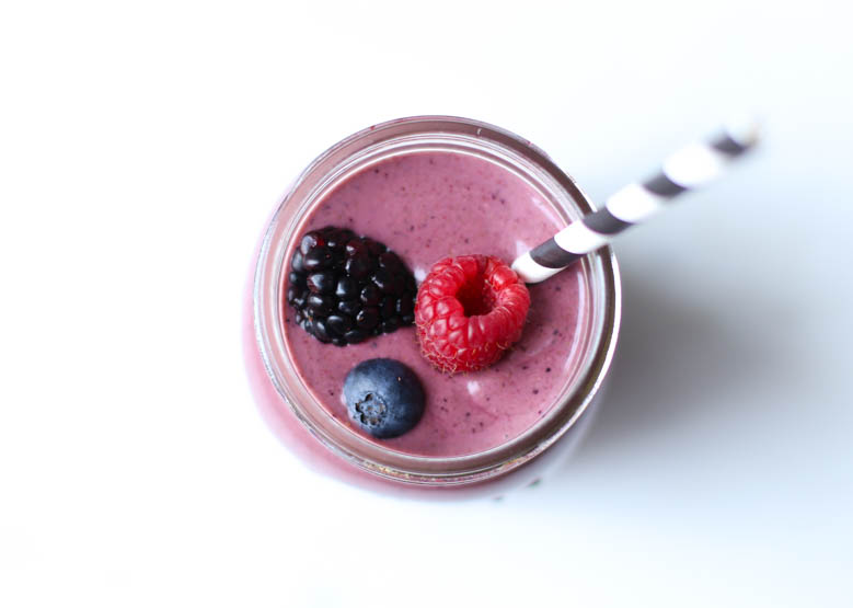 overhead shot of smoothie with berries on top