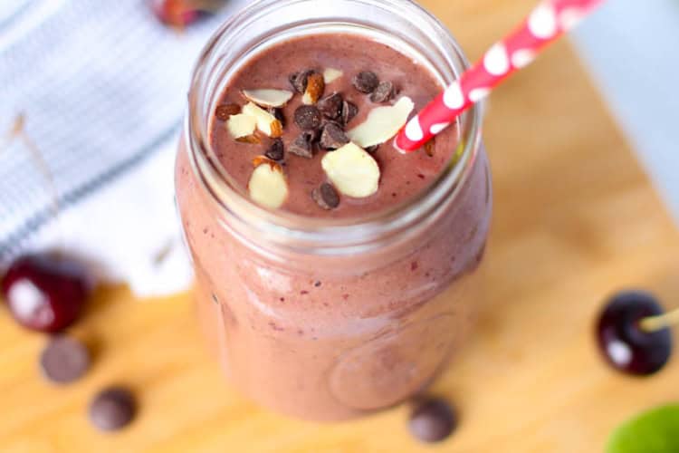 cherry smoothie in mason jar with straw