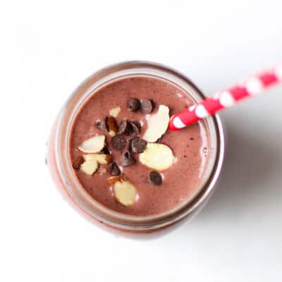 cherry smoothie in mason jar with straw
