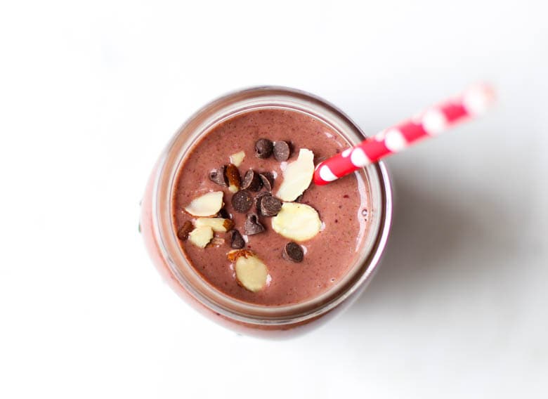 cherry smoothie in mason jar with straw