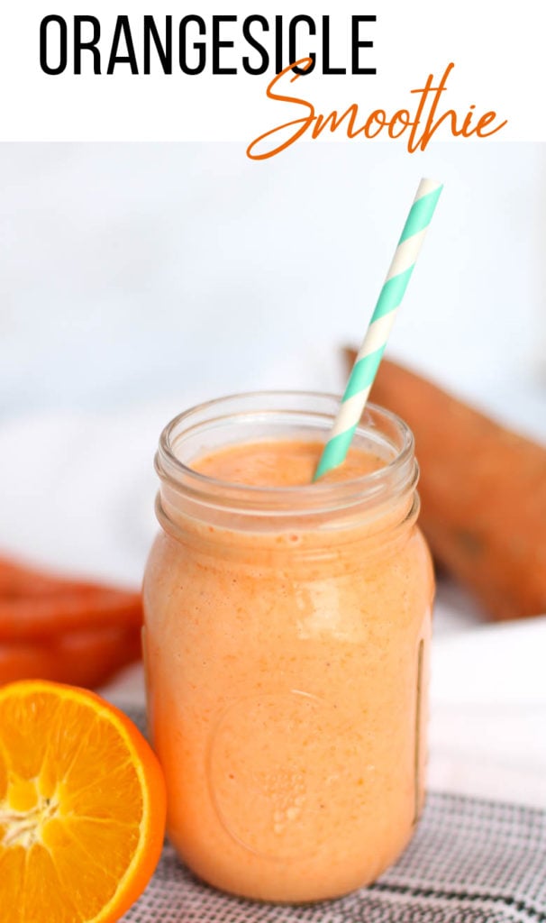 Orange smoothie in mason jar with straw