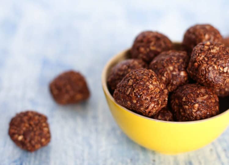 No baked chocolate oatmeal cookie bites in a yellow bowl.