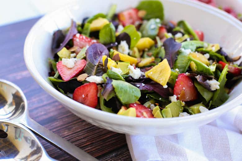 Strawberry avocado salad in a white bowl