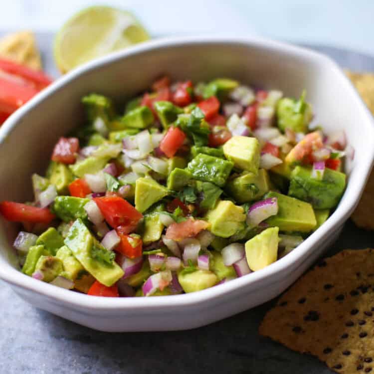 Avocado salsa in a white bowl.