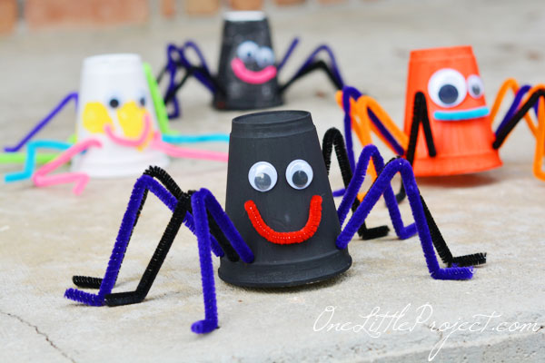 Styrofoam cup spider craft - black, orange and white painted cups with pipe cleaner legs and mouths and googly eyes.