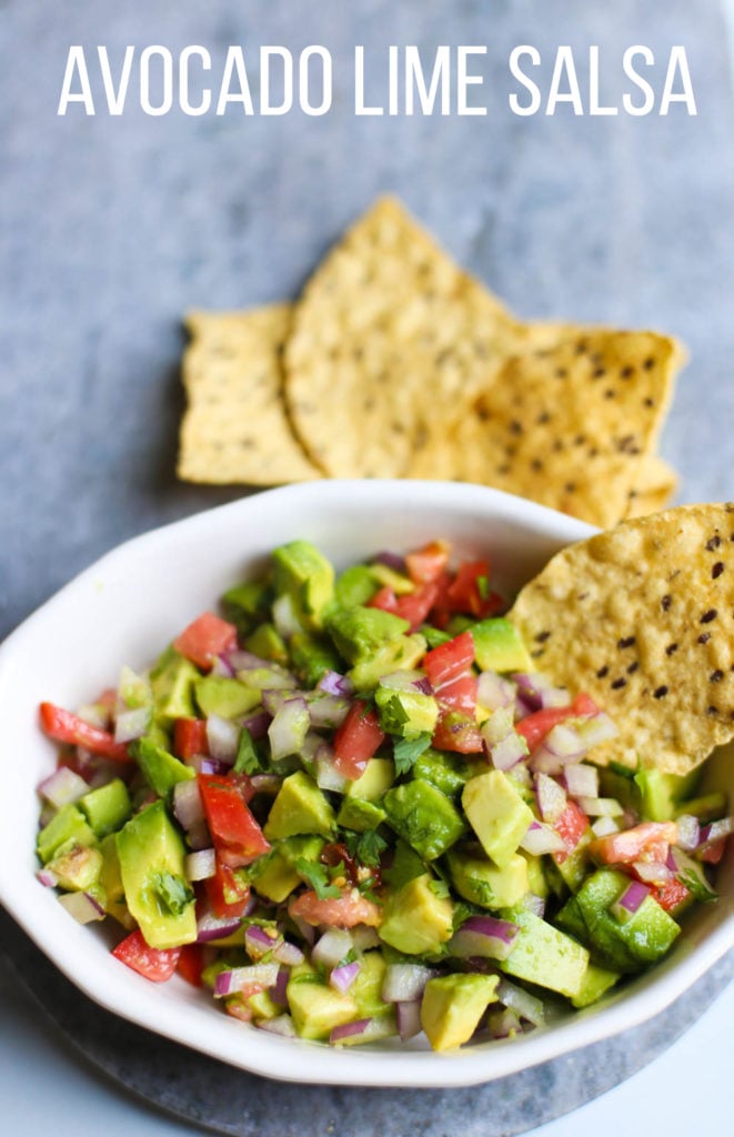 close up of Avocado Lime Salsa with tortilla chips