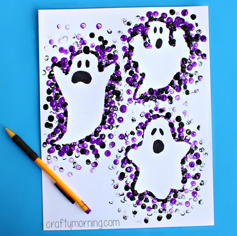 Ghost outlines made by using a pencil eraser in paint to stamp around cutouts.