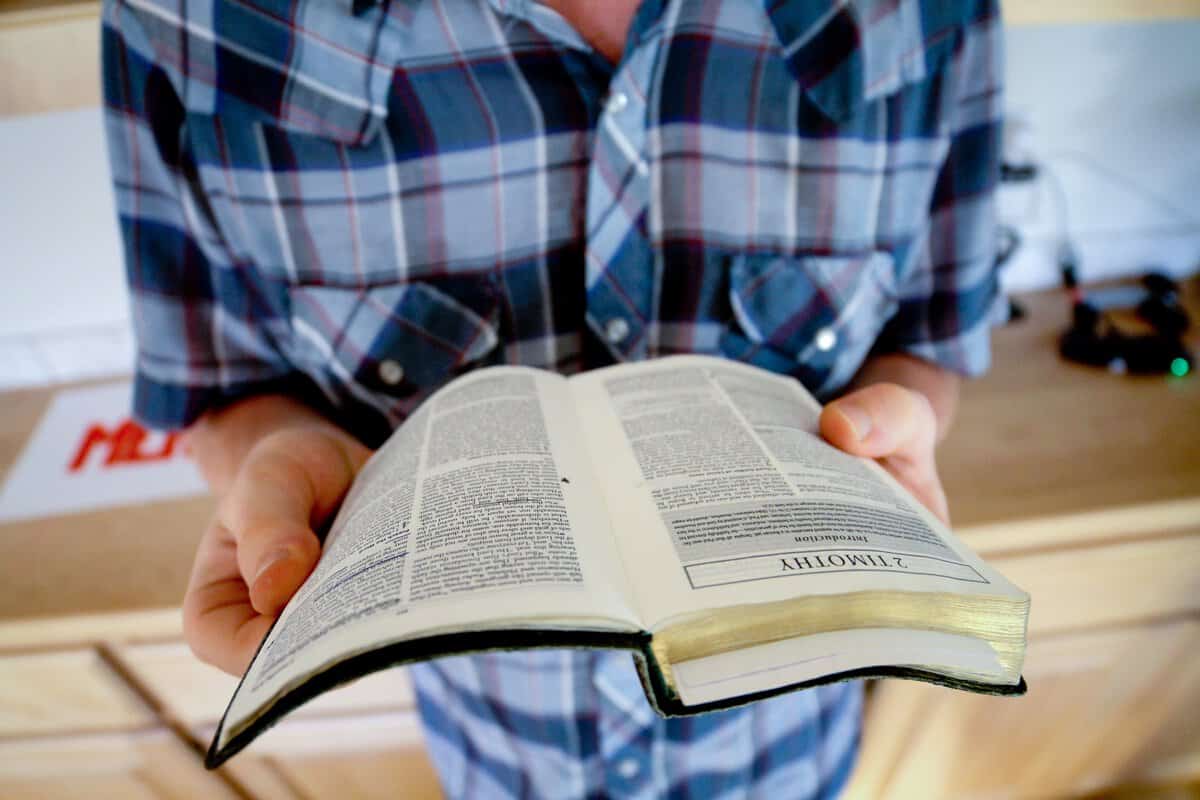 Teen holding Bible