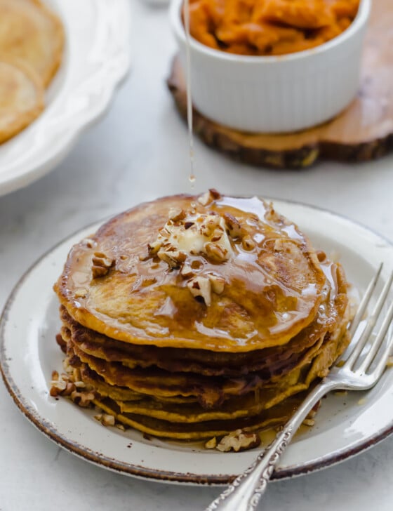 Whole wheat pumpkin pancakes with syrup on top