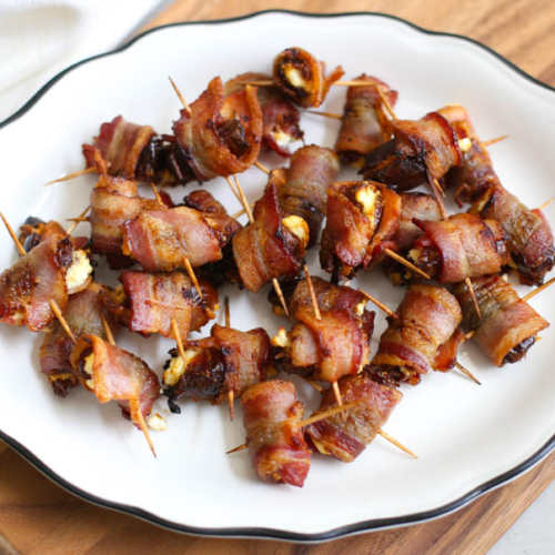 Bacon-Wrapped Dates with Goat Cheese on a plate