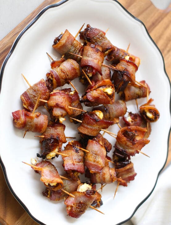 Bacon-Wrapped Dates with Goat Cheese on a plate