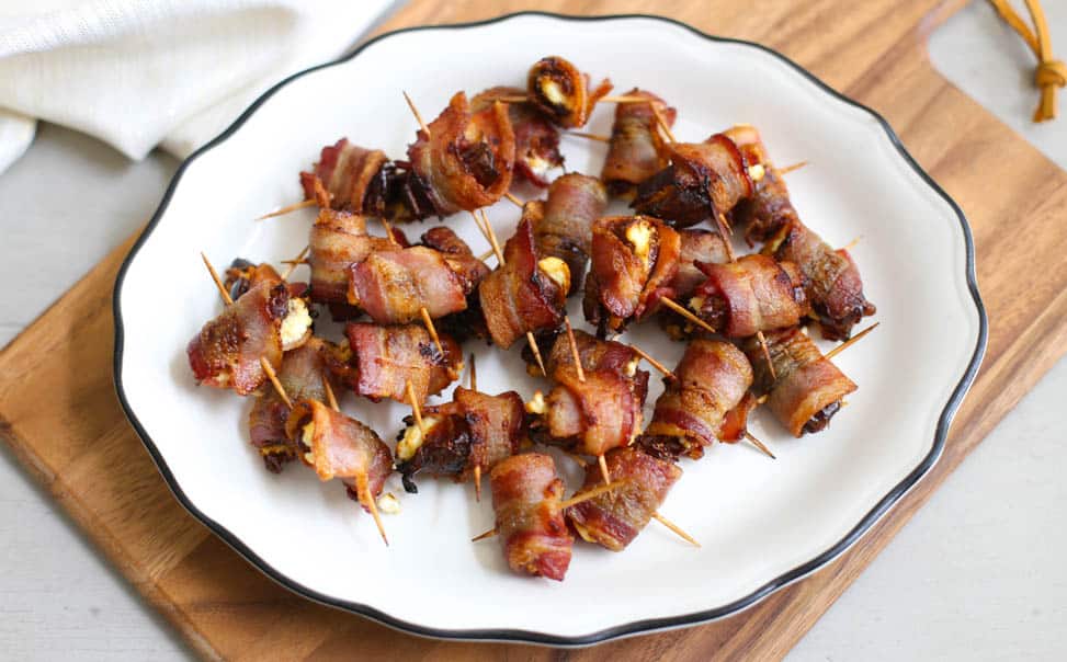 Bacon-Wrapped Dates with Goat Cheese on a plate