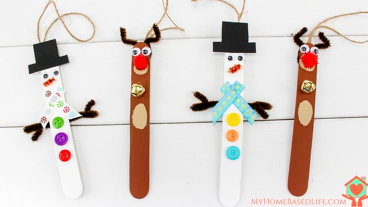 Popsicle sticks painted and decorated to look like reindeer and snowmen.