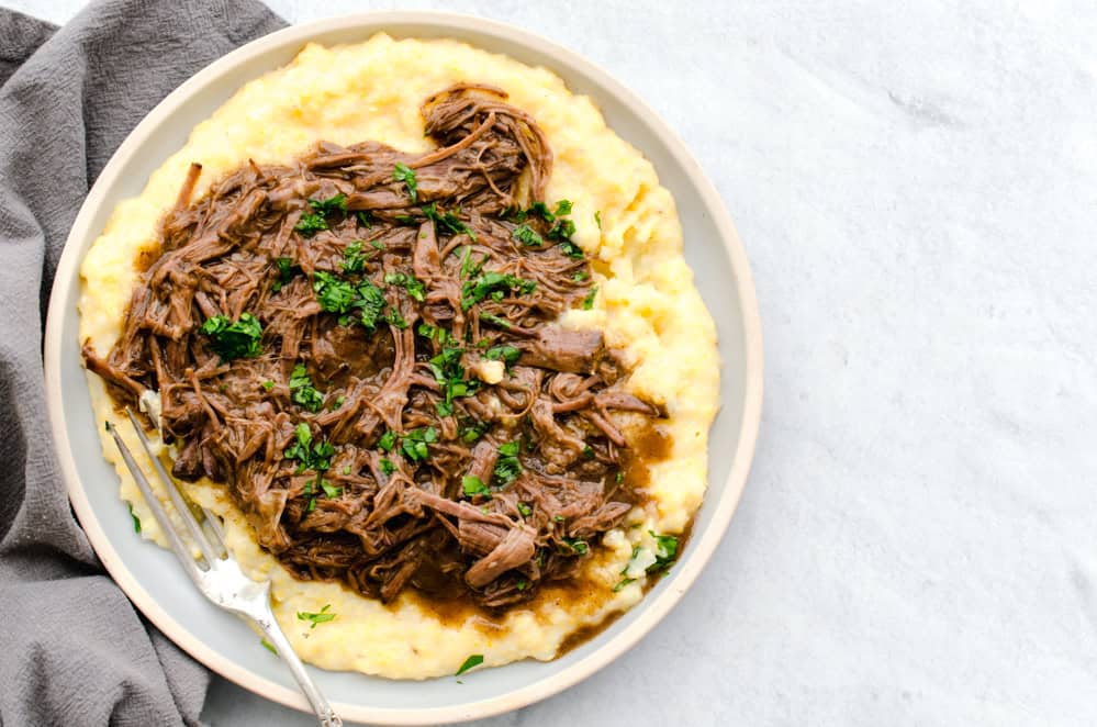 Bbalsamic shredded beef served on polenta.