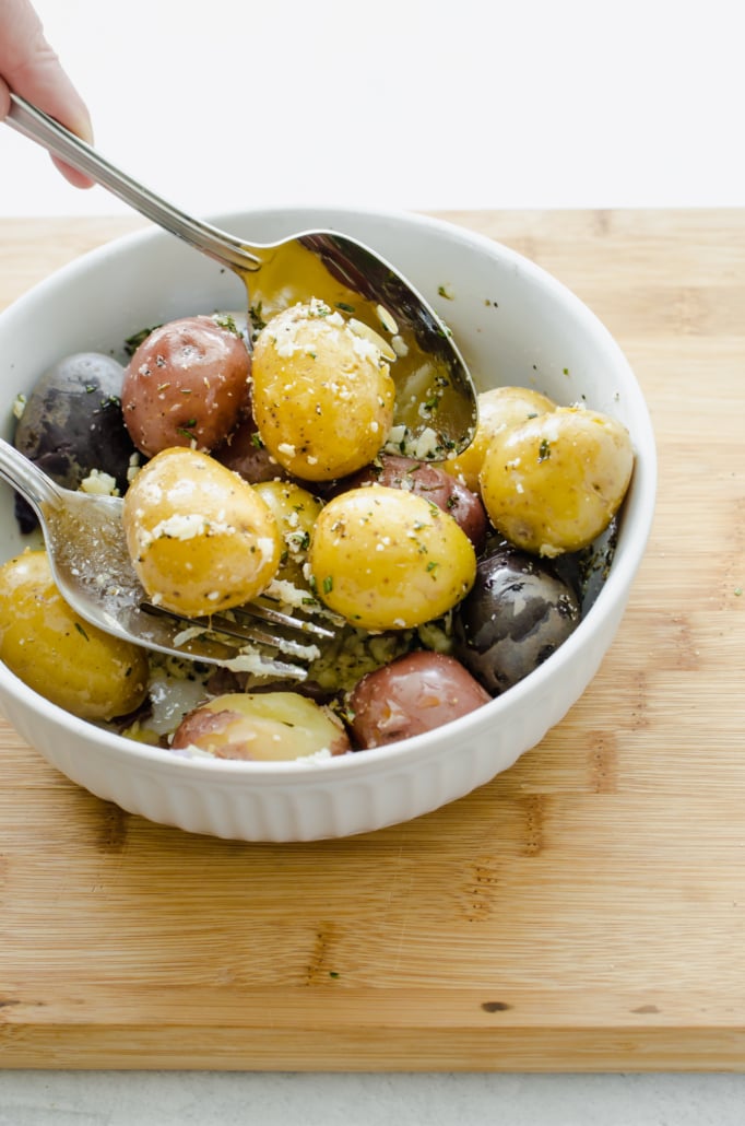 Boiled baby potatoes in a white bowl