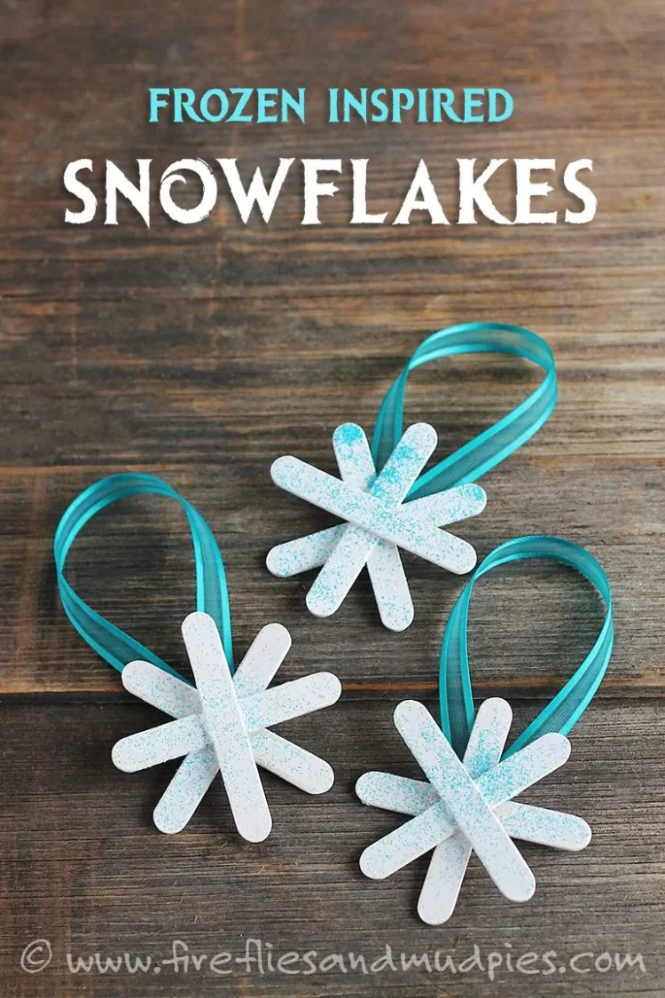 Popsicle sticks glued to look like a star painted white with glitter sprayed on and a teal ribbon for hanging.