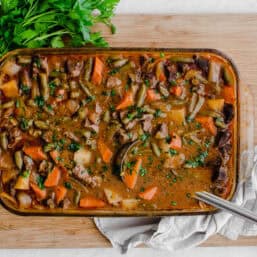 Finished easy beef stew cooked in a casserole dish.