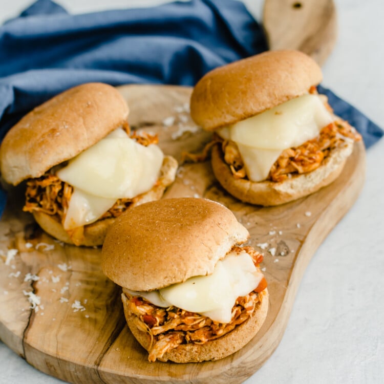 chicken parmesan sliders on a cutting board