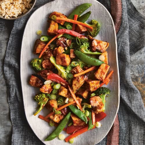 Honey Bourbon Chicken and Stir Fry Vegetables on a large white platter