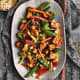 Honey Bourbon Chicken and Stir Fry Vegetables on a large white platter.