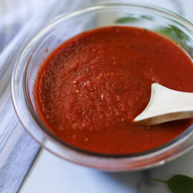 Bowl of homemade pizza sauce with <a href=