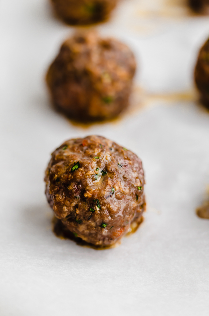 baked italian meatball cooked on a sheet pan