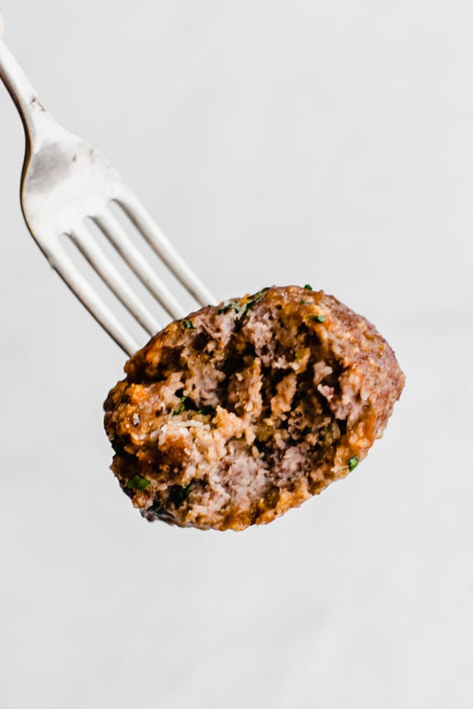 Baked italian meatball on a fork