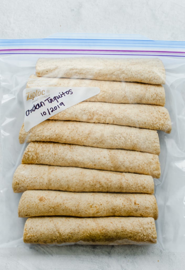 Taquitos rolled up and in a freezer bag for a freezer meal.