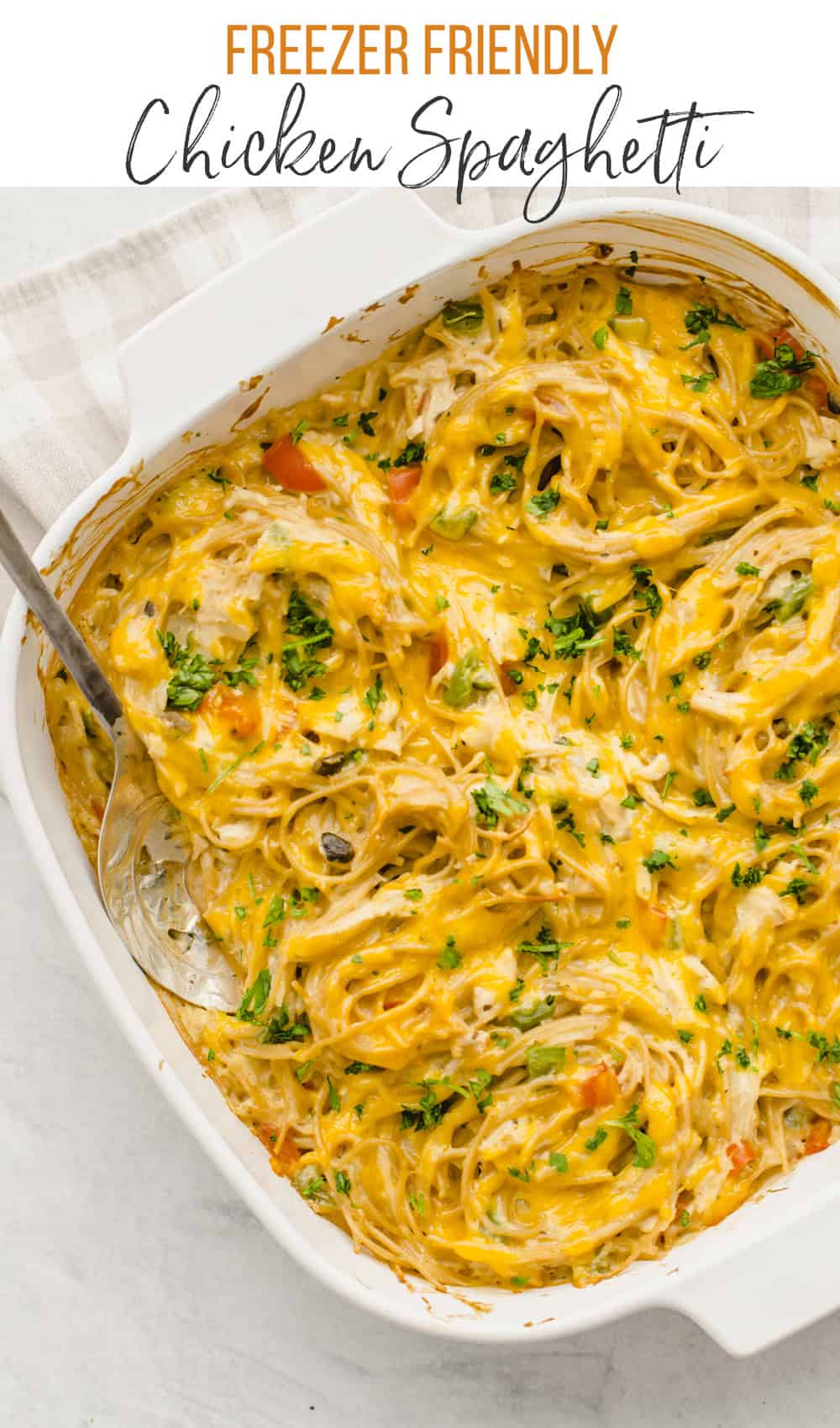 Freezer-friendly chicken spaghetti in  white casserole dish.