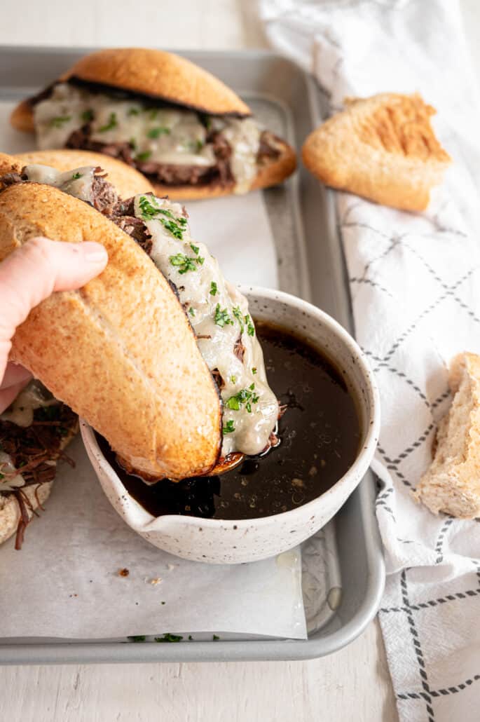 French Dip sandwich dipped in au jus sauce