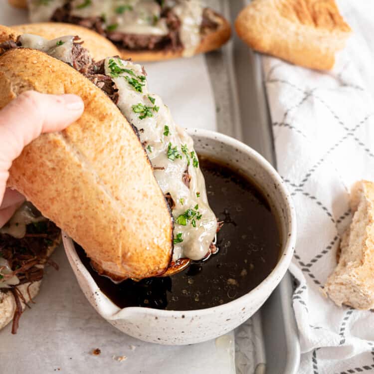 French Dip sandwich dipped in au jus sauce