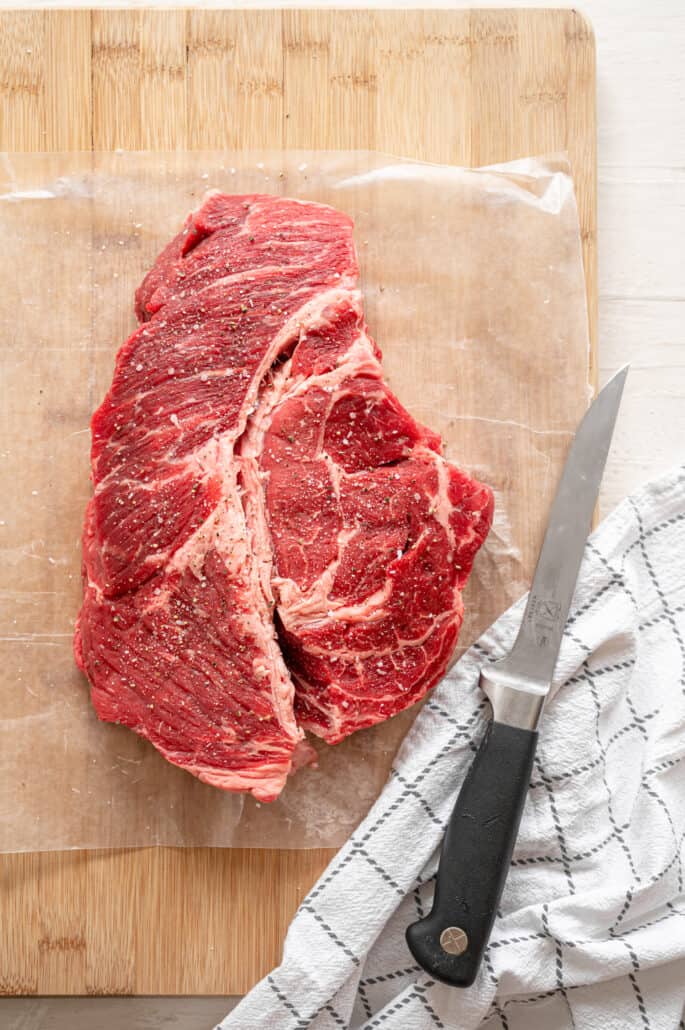 seasoned beef chuck roast on a cutting board