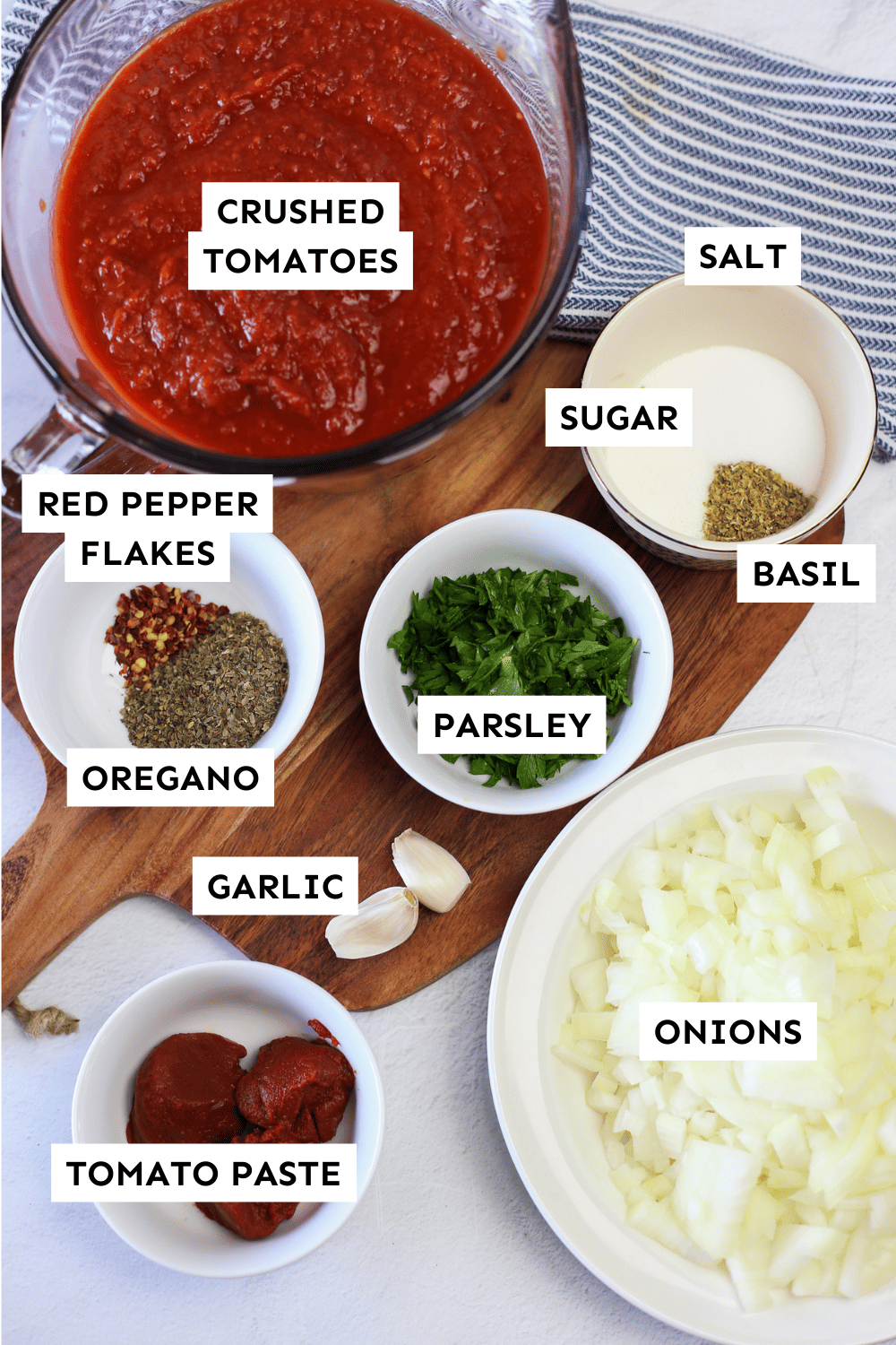 Labeled ingredients for crock pot marinara sauce. 