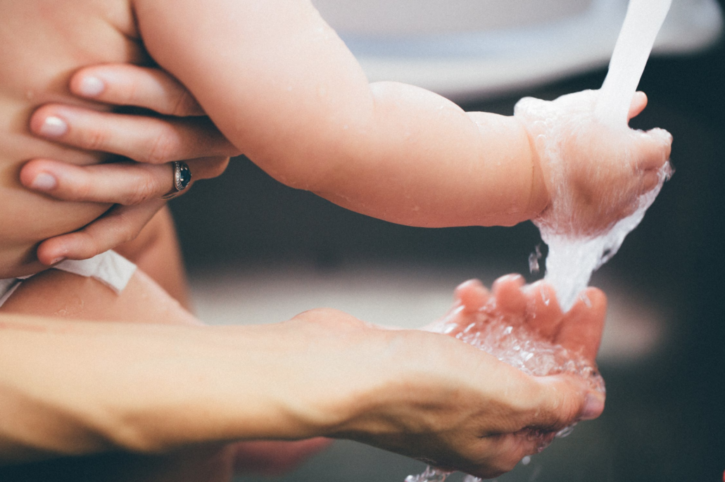Baby and mom washing hands