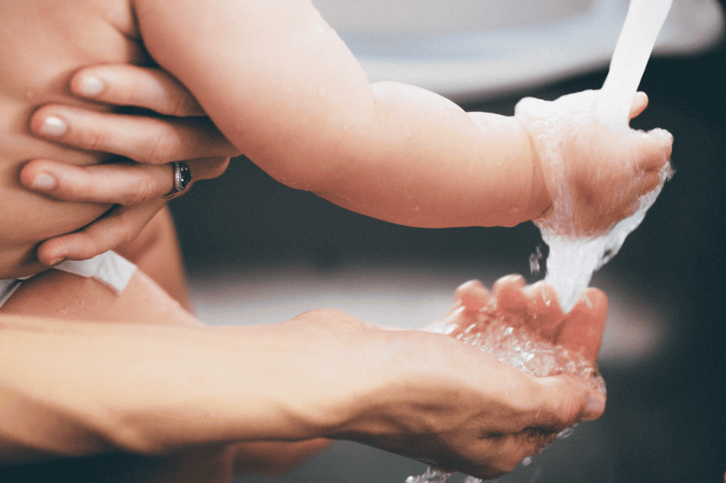 Baby and mom washing hands