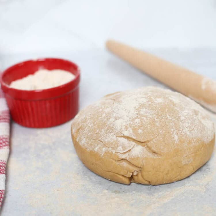 Ball of pizza dough ready to be rolled out.