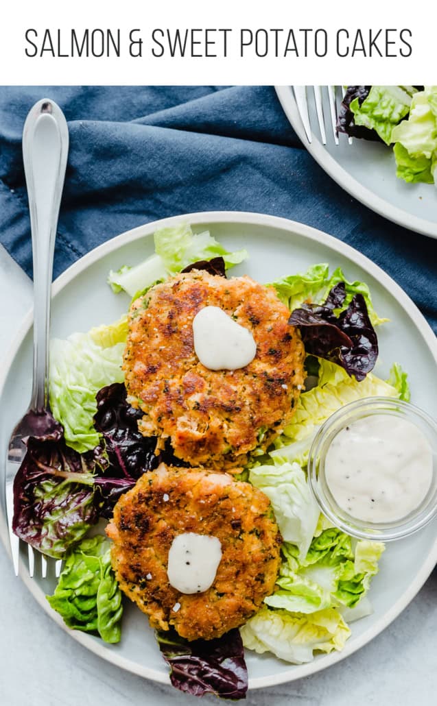 salmon cakes on a plate with lettuce and tartar sauce