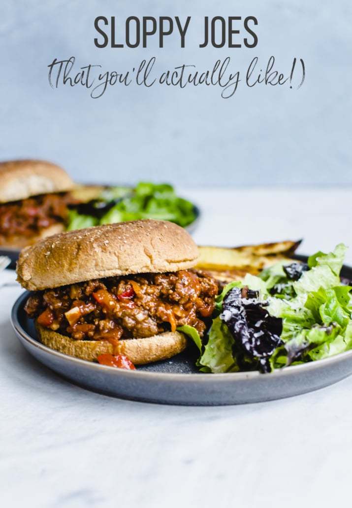 Sloppy Joes in a bun on a plate with salad
