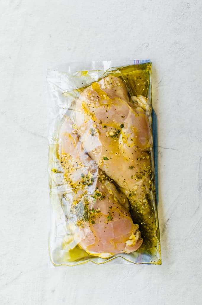 Freezer bag with chicken breasts in lemon garlic marinade.