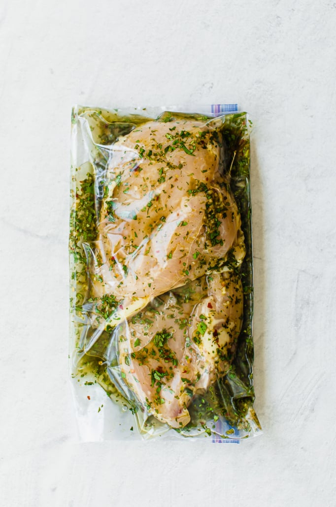 cilantro lime marinade and chicken breasts in a sealed freezer bag