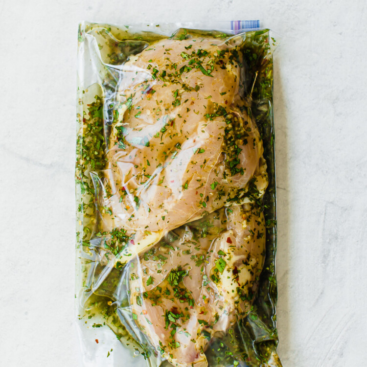 cilantro lime marinade and chicken breasts in a sealed freezer bag