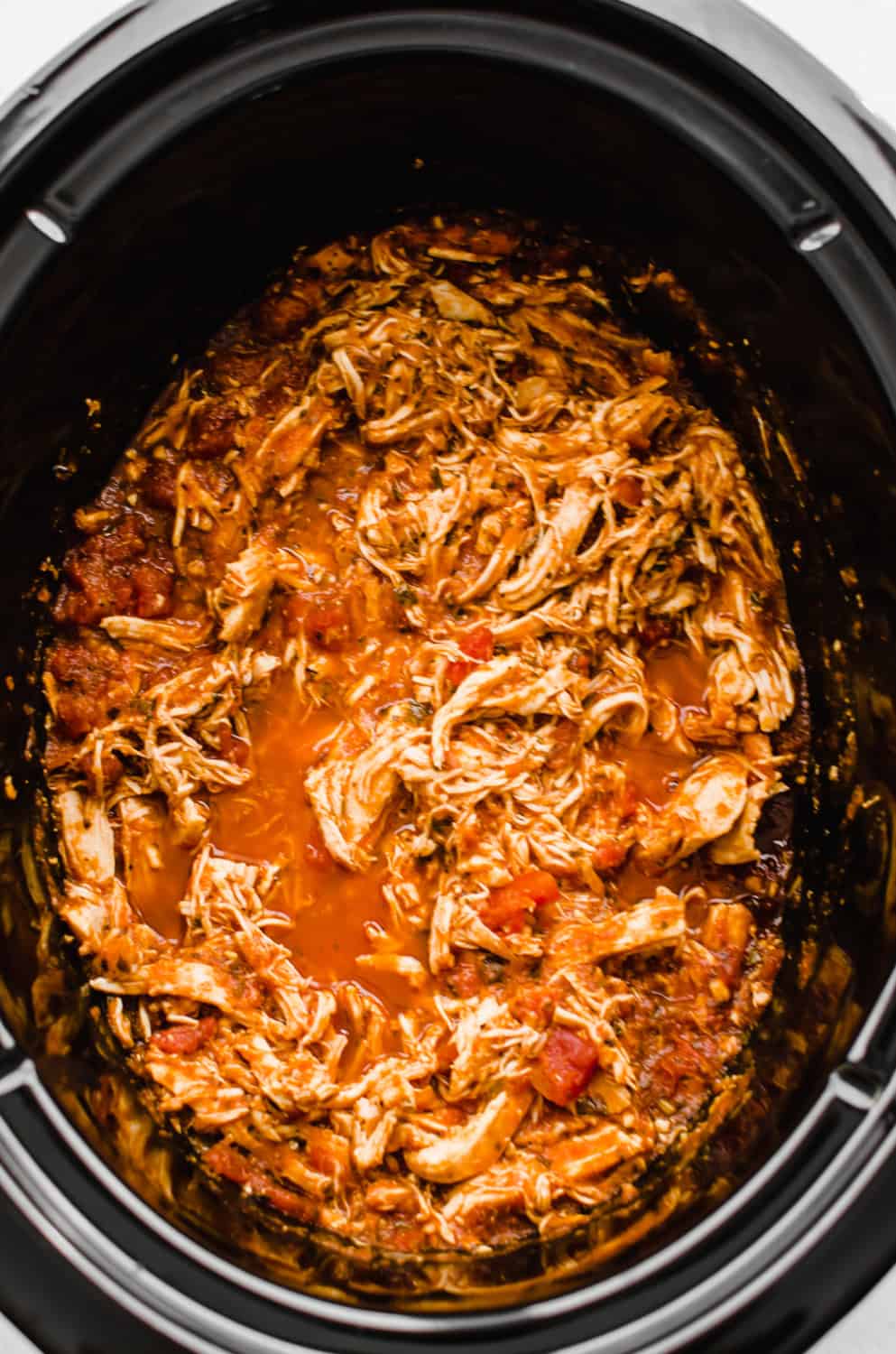 Shredded BBQ chicken in a crock pot. 